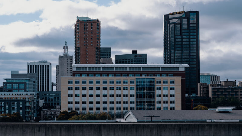 Downtown Saint Paul skyline with the brick tower of The Pointe of St. Paul rising left of the Wells Fargo Place tower